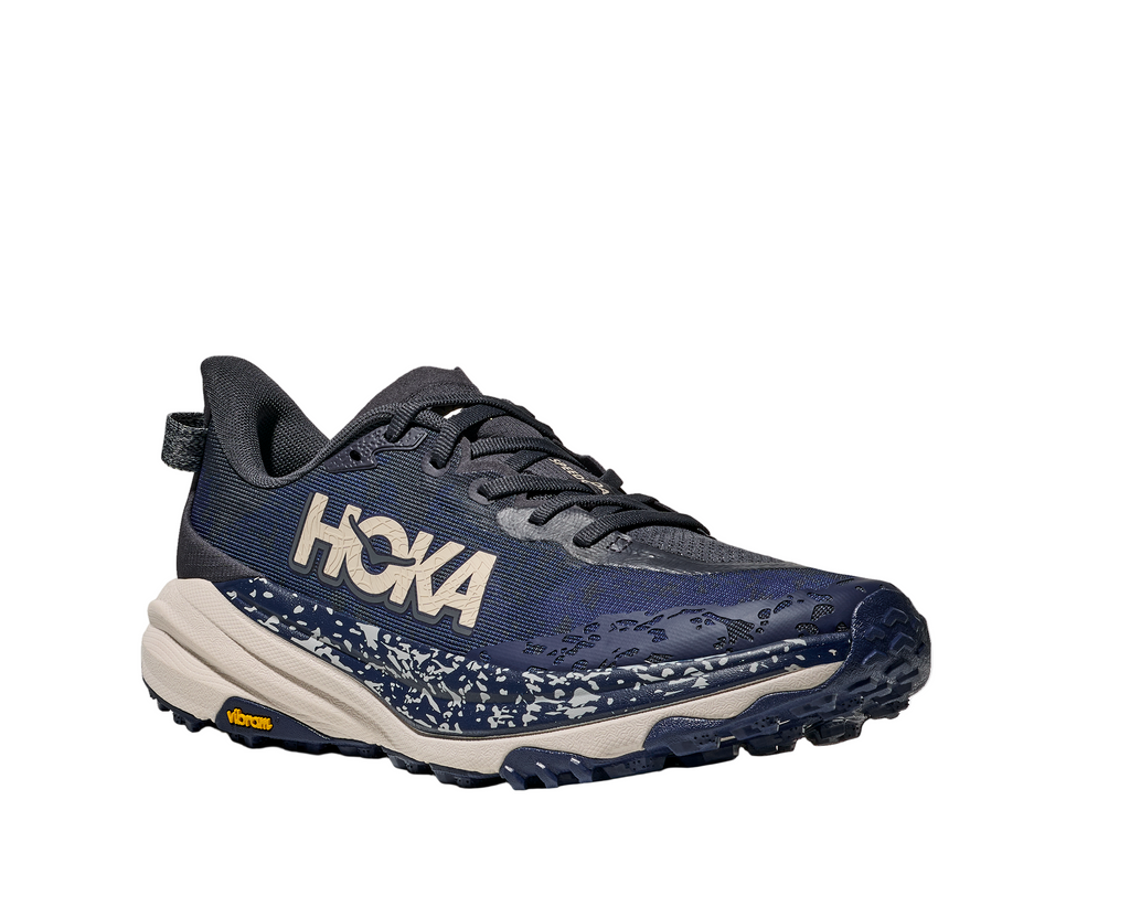 Men's Hoka Speedgoat 6. Navy blue upper. Cream midsole. Lateral view.