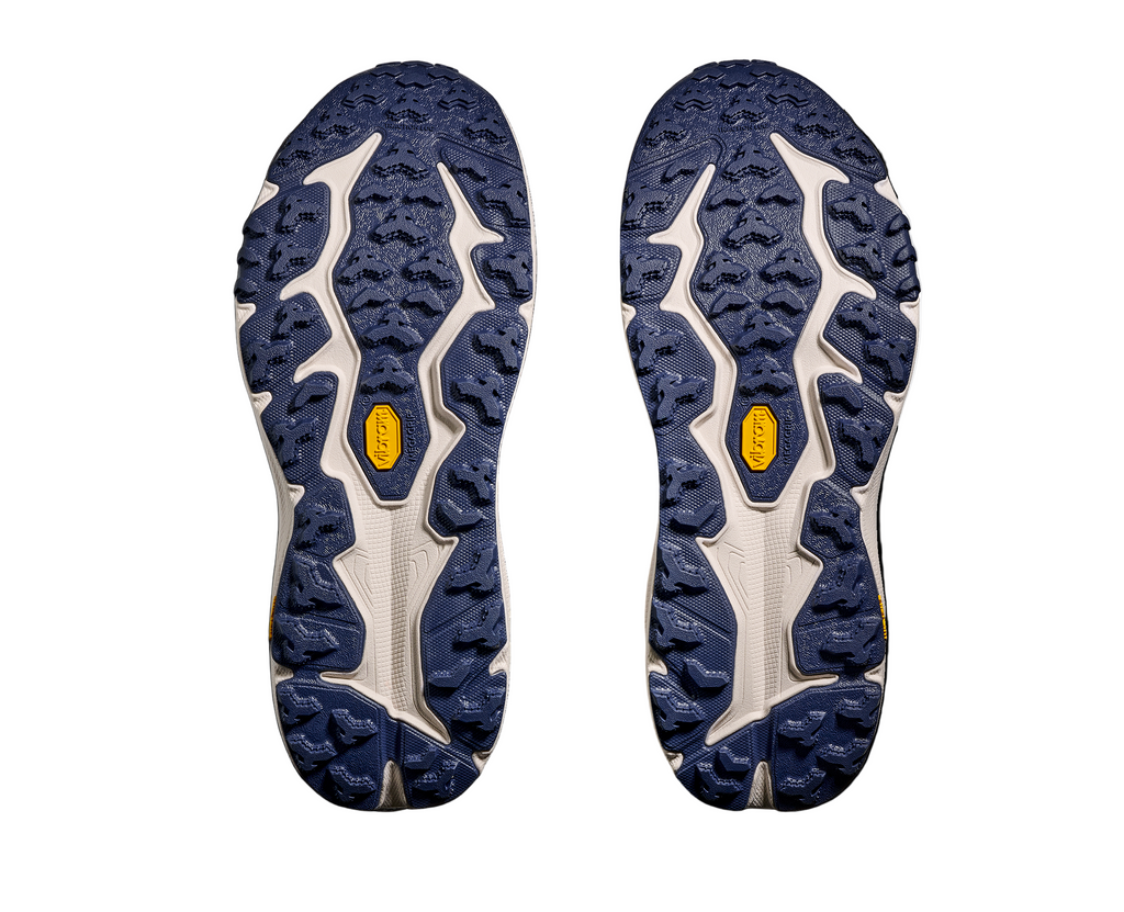 Men's Hoka Speedgoat 6. Navy blue upper. Cream midsole. Bottom view.