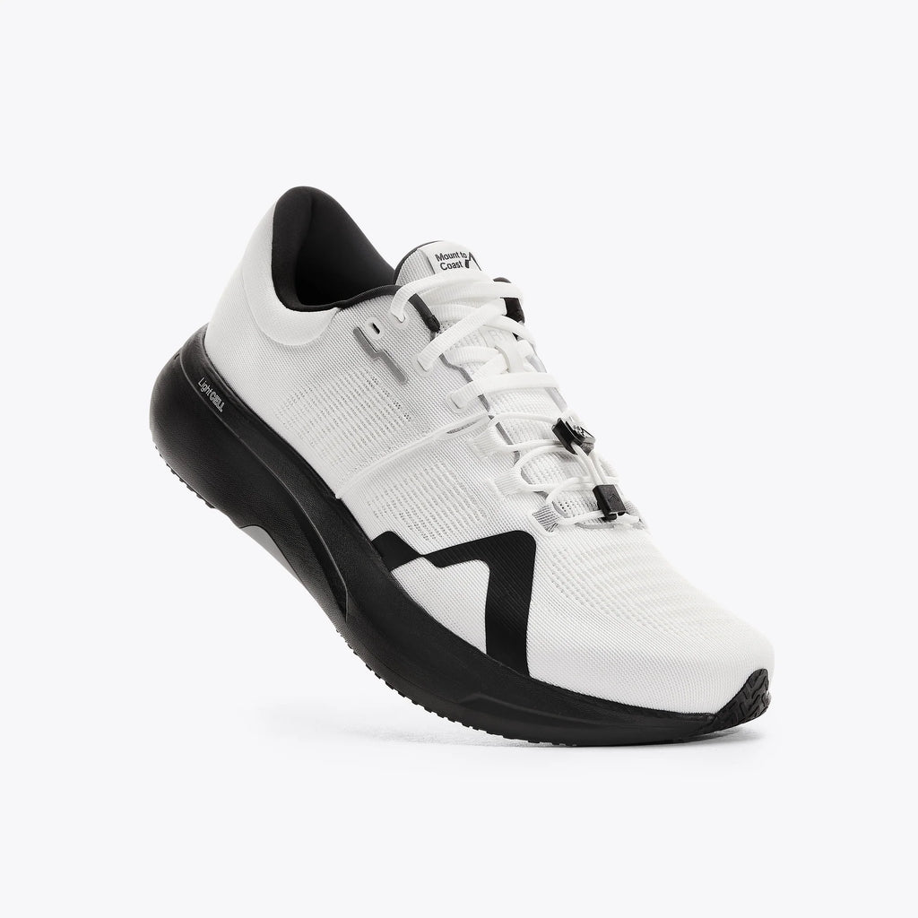 Men's Mount to Coast. R1. White upper. Black midsole. Lateral view.