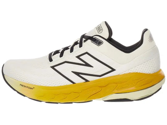 Men's New Balance 860 v14. White upper. Yellow midsole. Lateral view.