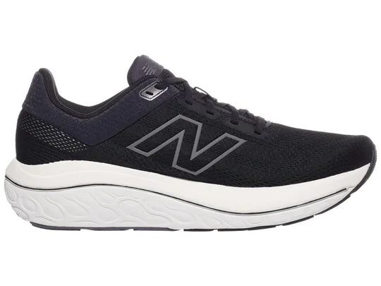 Men's New Balance 860v14. Black upper. White midsole. Medial view.