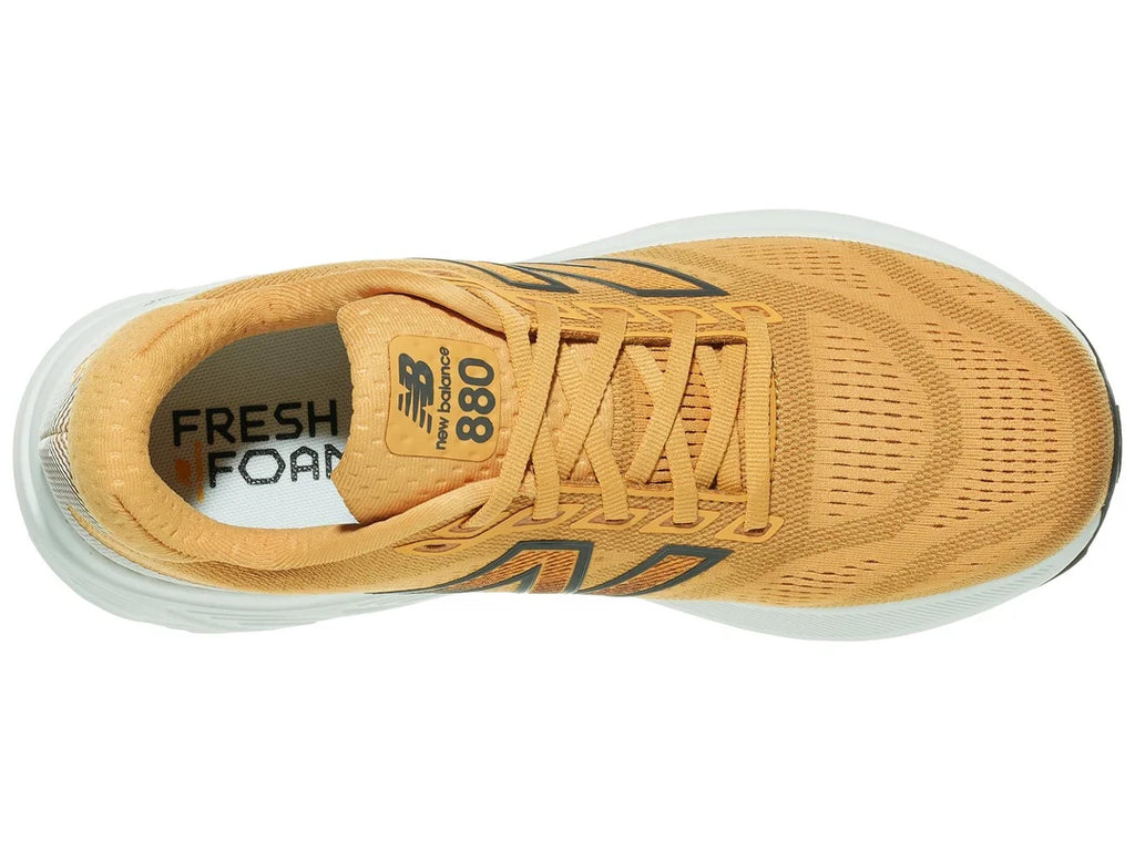 Men's New Balance 880v15. Orange upper. White midsole. Top view.