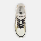 Men's New Balance Ellipse. White, black, and gold upper. White and gold midsole. Top view.