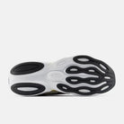 Men's New Balance Ellipse. White, black, and gold upper. White and gold midsole. Bottom view.