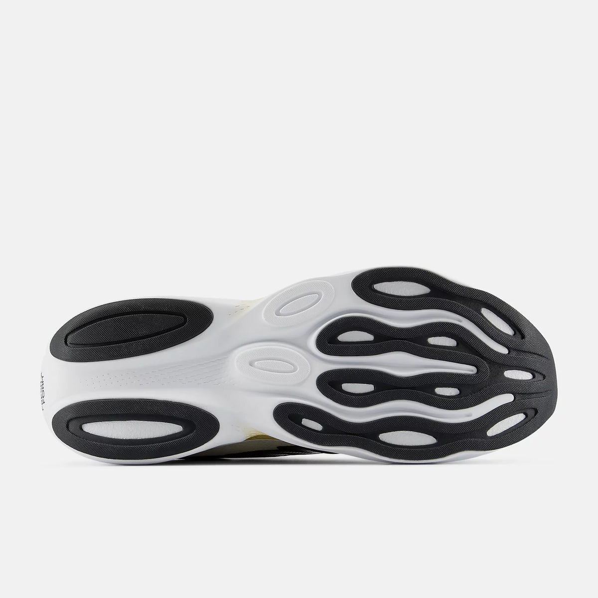 Men's New Balance Ellipse. White, black, and gold upper. White and gold midsole. Bottom view.