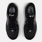 Men's New Balance 860 v15. Black upper. White midsole. Top view.