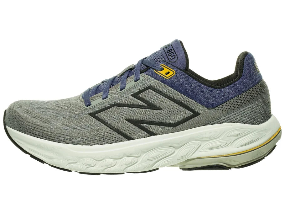 Men's New Balance 860 v14. Grey upper. Off White midsole. Lateral view.