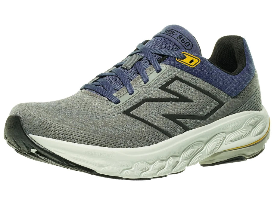 Men's New Balance 860 v14. Grey upper. Off White midsole. Lateral view.
