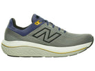 Men's New Balance 860 v14. Grey upper. Off White midsole. Medial view.