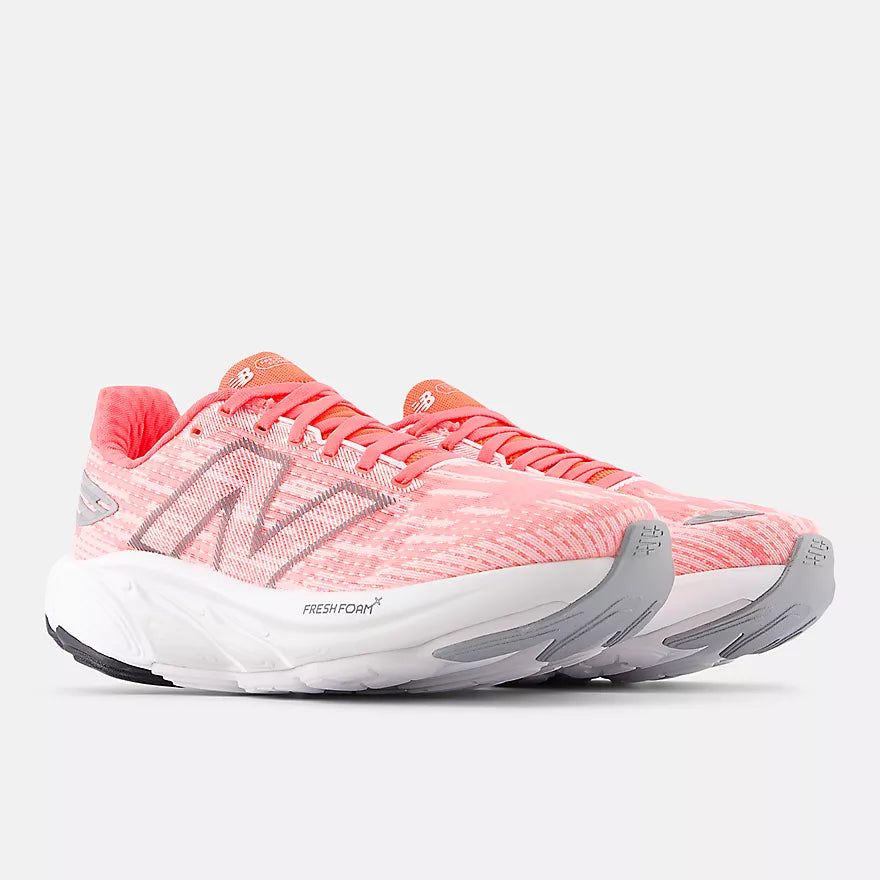 Men's New Balance Balos v1. Pink upper. White midsole. Lateral view.