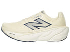 Men's New Balance Fresh Foam X More v5 in Angora/Sea Salt/Hot Mango — side profile