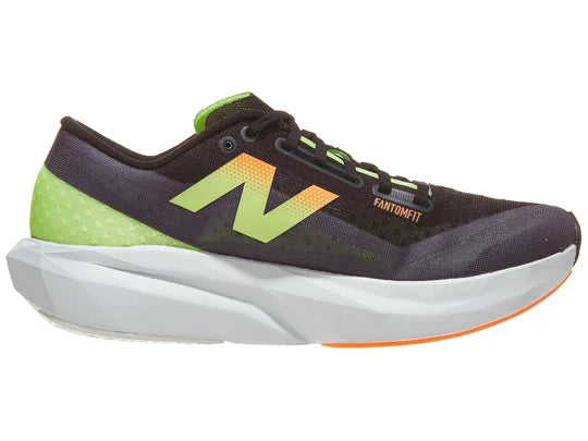 Men's New Balance Rebel v4. Black upper. White midsole. Medial view.
