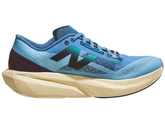 Men's New Balance Rebel v4. Blue upper. Off White midsole. Medial view.