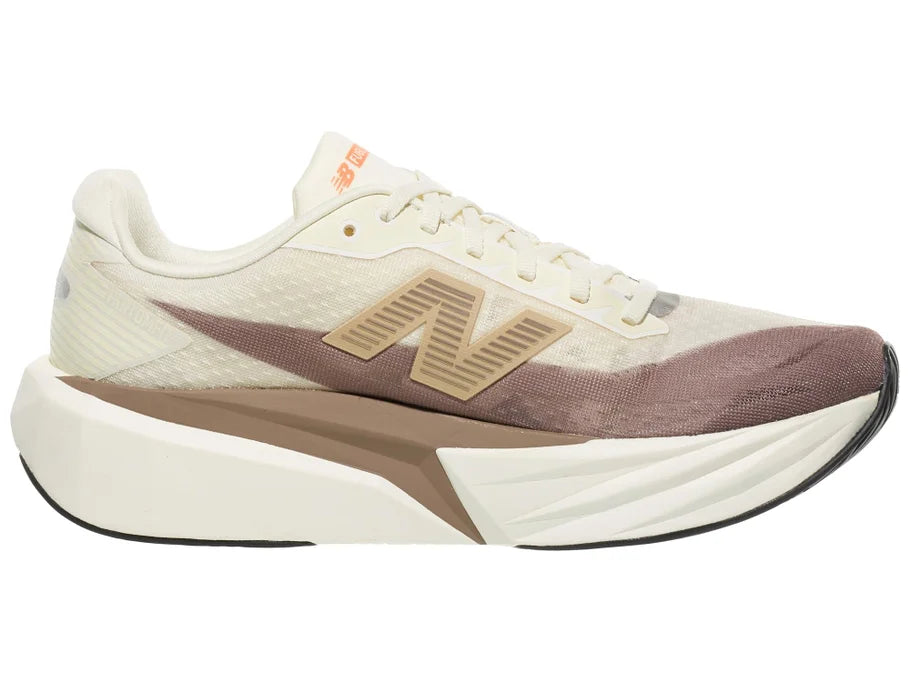 Men's New Balance Rebel v5. Off White/Tan upper. Off White/Tan midsole. Medial view.