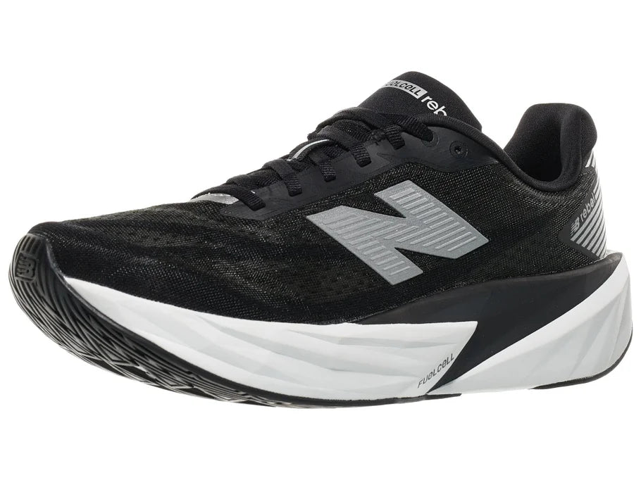 Men's New Balance Rebel v5. Black upper. White midsole. Lateral view.