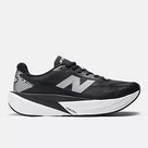Men's New Balance Rebel v5. Black upper. White midsole. Lateral view.