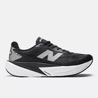 Men's New Balance Rebel v5. Black upper. White midsole. Lateral view.