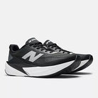 Men's New Balance Rebel v5. Black upper. White midsole. Lateral view.