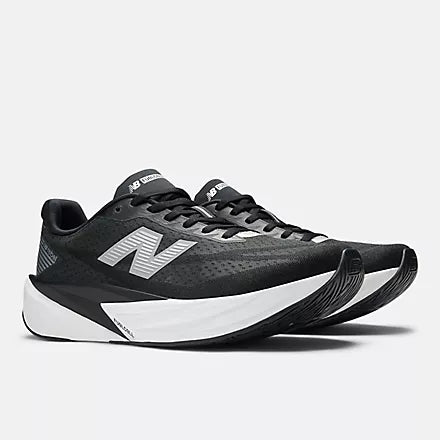 Men's New Balance Rebel v5. Black upper. White midsole. Lateral view.