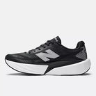 Men's New Balance Rebel v5. Black upper. White midsole. Medial view.