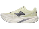 Men's New Balance Rebel v5. Yellow upper. White midsole. Lateral view.