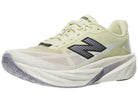 Men's New Balance Rebel v5. Yellow upper. White midsole. Lateral view.