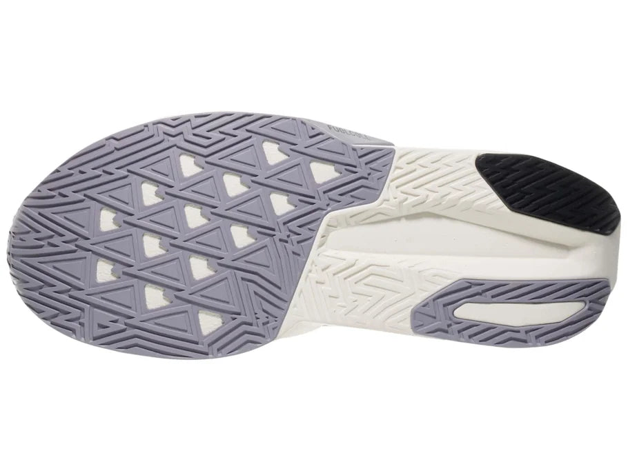 Men's New Balance Rebel v5. Yellow upper. White midsole. Bottom view.