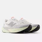 Men's New Balance Rebel v5. Grey upper. Off White midsole. Lateral view.