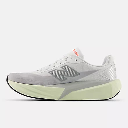 Men's New Balance Rebel v5. Grey upper. Off White midsole. Medial view.