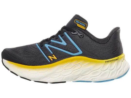 Men's New Balance More V4. Dark Grey upper. White midsole. Lateral view.