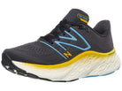 Men's New Balance More V4. Dark Grey upper. White midsole. Lateral view.