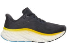 Men's New Balance More V4. Dark Grey upper. White midsole. Medial view.