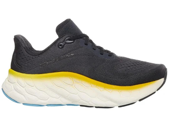 Men's New Balance More V4. Dark Grey upper. White midsole. Medial view.