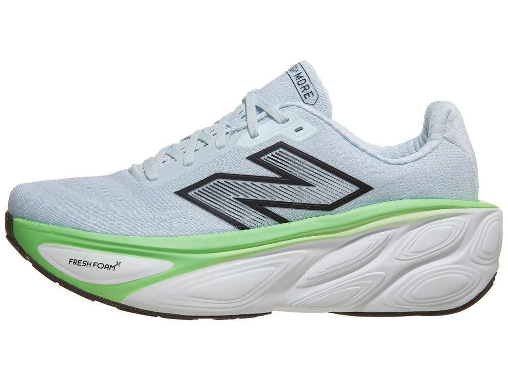 Men's New Balance More v5. Light blue upper. White and green midsole. Lateral view.