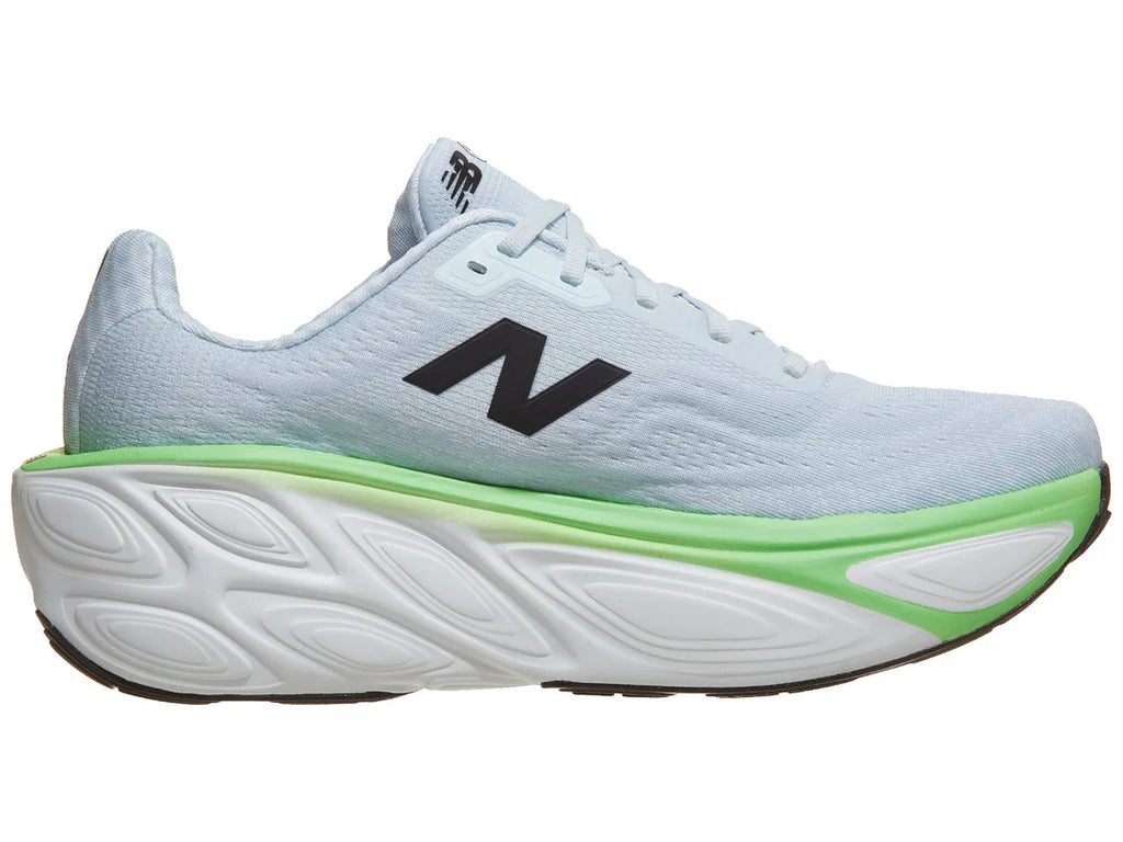 Men's New Balance More v5. Light blue upper. White and green midsole. Medial view.