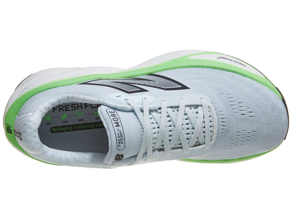 Men's New Balance More v5. Light blue upper. White and green midsole. Top view.