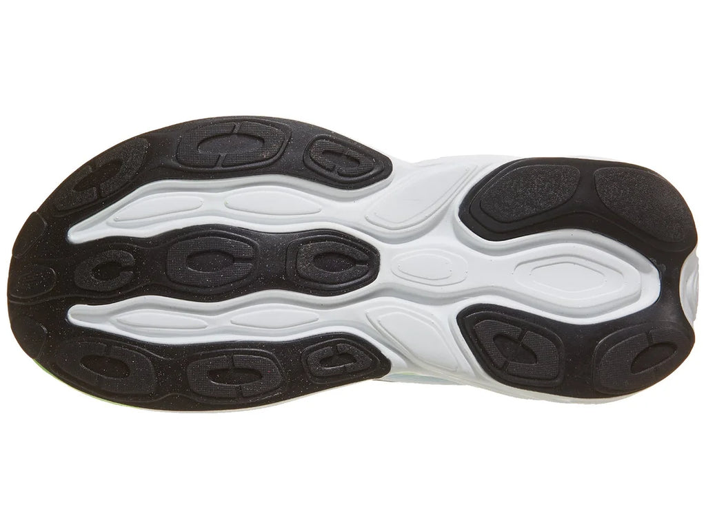 Men's New Balance More v5. Light blue upper. White and green midsole. Bottom view.