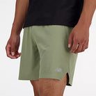 Men's New Balance RC Shorts. Green. Lateral view.