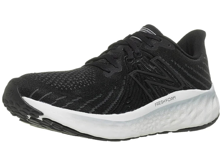 Men's New Balance Vongo V5. Black upper. White midsole. Lateral view.