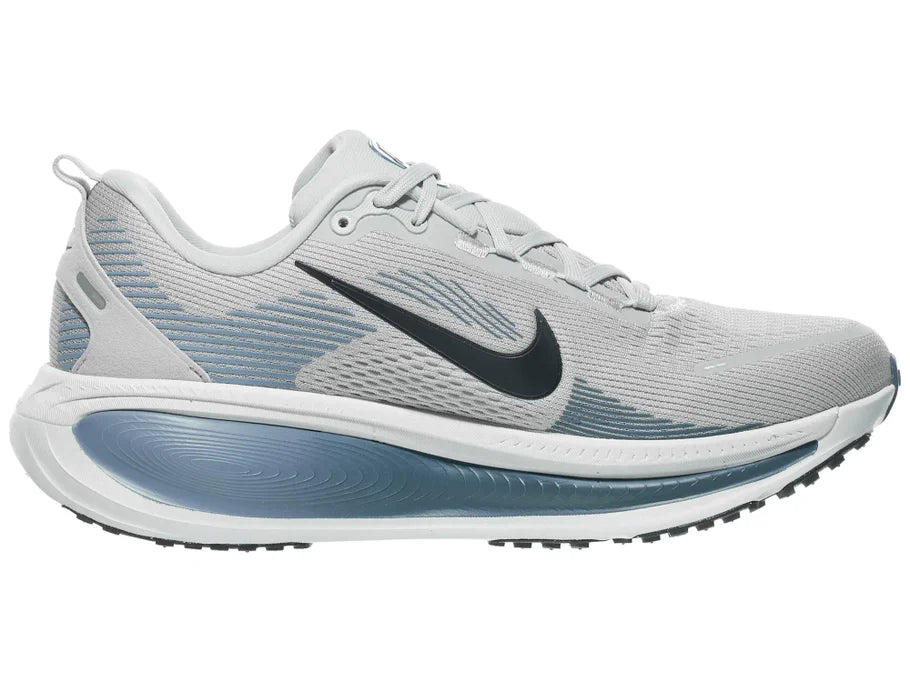 Men's Nike Vomero 18. Light Grey upper. White midsole. Medial view.