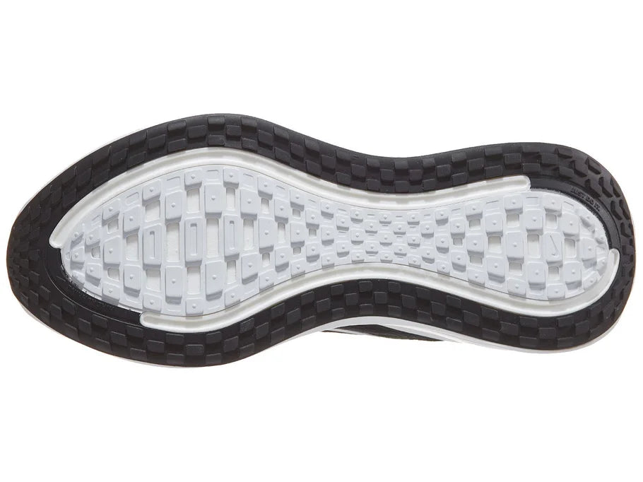 Men's Nike Vomero Plus. Black upper. White midsole. Bottom view.