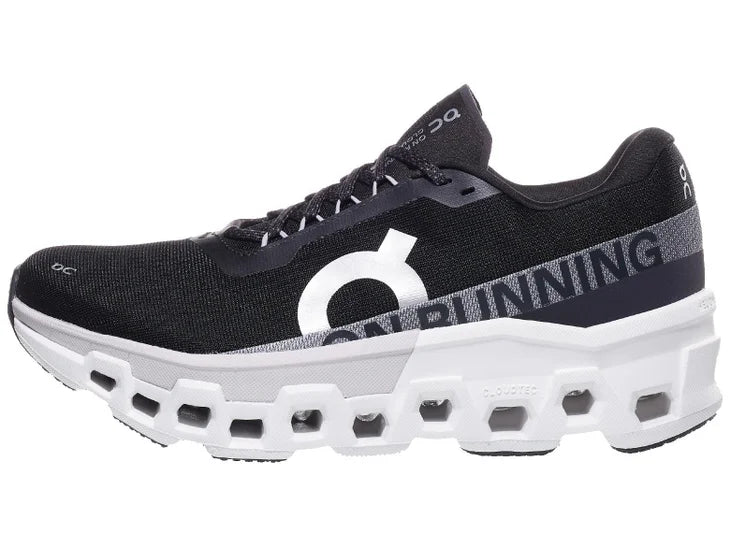 Men's On Cloudmonster 2. Black upper. White midsole. Lateral view.