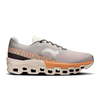 Men's On Cloudmonster 2. Cream and orange upper. Cream and orange midsole. Lateral view.