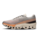 Men's On Cloudmonster 2. Cream and orange upper. Cream and orange midsole. Medial view.