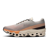 Men's On Cloudmonster 2. Cream and orange upper. Cream and orange midsole. Medial view.