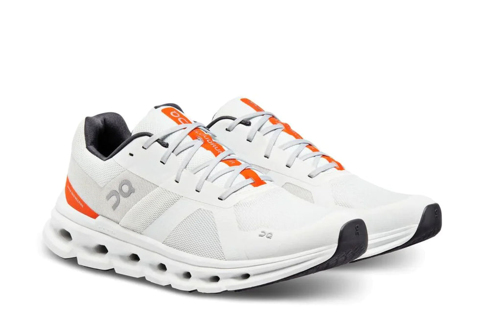 Men's On Cloudmonster. White upper. White midsole. Lateral view.