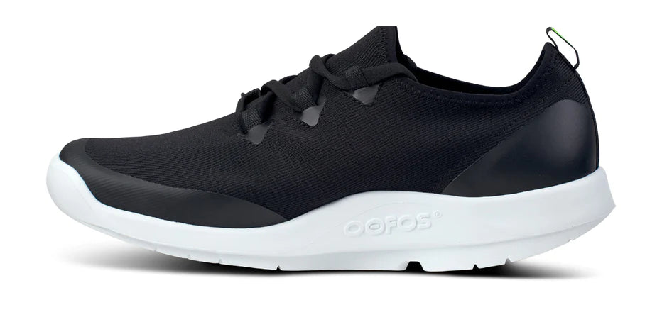 Oofos OOmg Sport LS Shoe. Black upper. White midsole. Medial view.