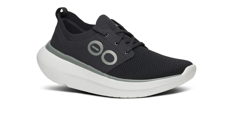 Men's Oofos OOmy Stride. Black upper. White midsole. Lateral view.