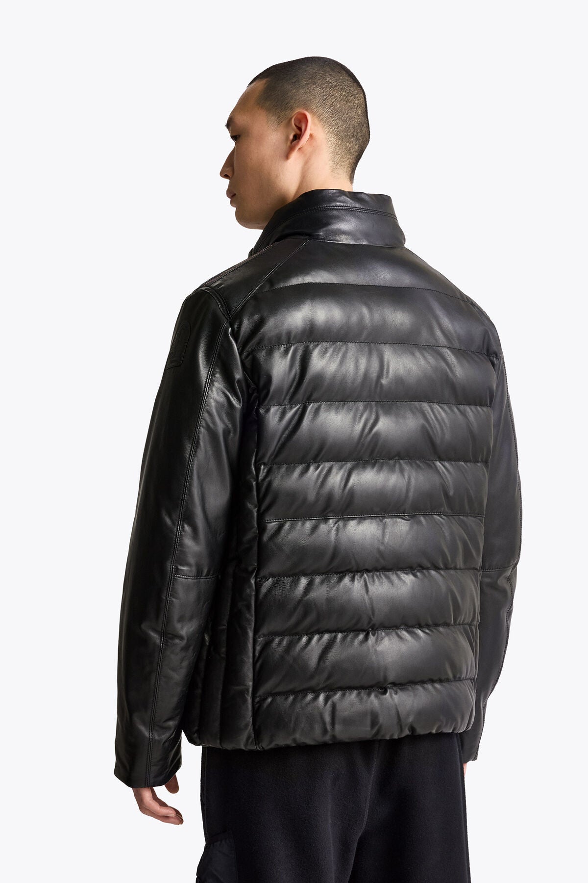 Men wearing the Parajumpers Ernie leather jacket in Black, rear lifestyle view