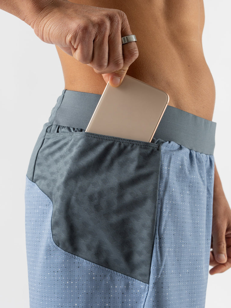 Men's Rabbit FKT 2.0 5". Blue with small grey and white dots. Lateral view, up close.